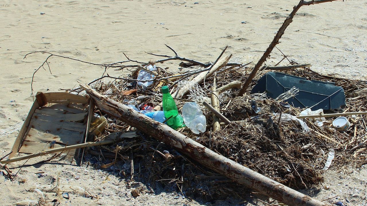 HIGH ANGLE VIEW OF DAMAGED UMBRELLA ON THE GROUND