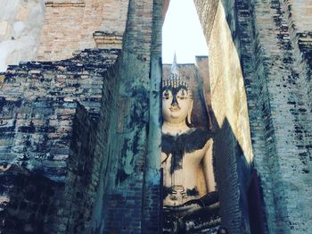 Statue of buddha outside building