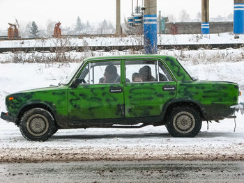 Vintage car on street during winter