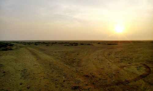 Scenic view of landscape against sky during sunset