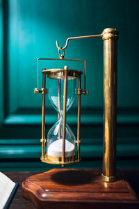 Close-up of hourglass on table