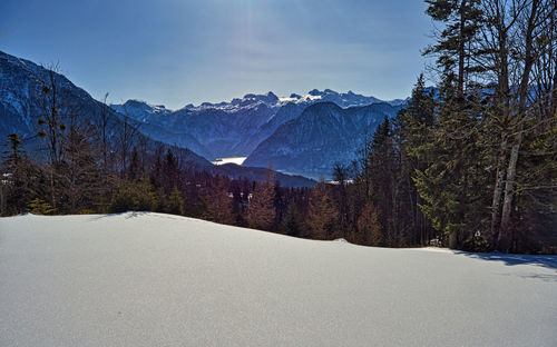 Scenic view of snowcapped mountains against sky