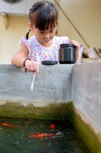 Cute girl playing in water