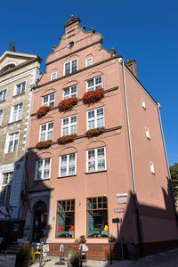 Low angle view of buildings against clear sky