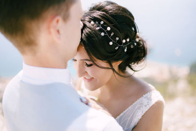 Portrait of couple kissing outdoors