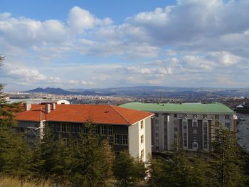 Houses and buildings against sky