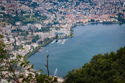 High angle view of townscape by sea