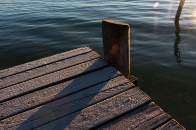 Cropped image of jetty over lake