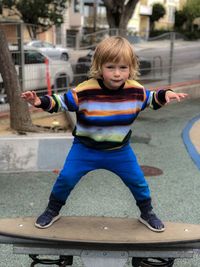 Full length portrait of cute boy at playground