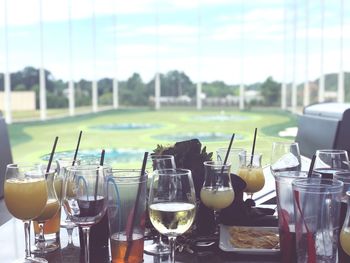 Close-up of wine glasses on table