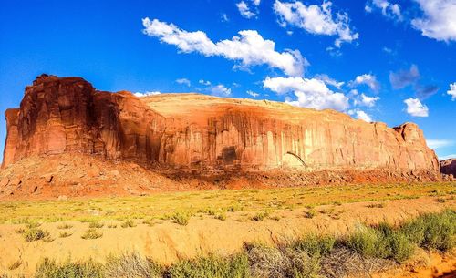 Scenic view of landscape against blue sky