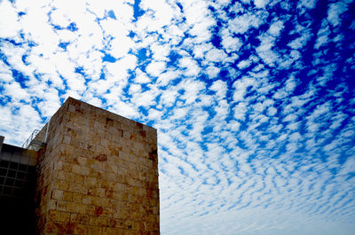 Low angle view of built structure against blue sky