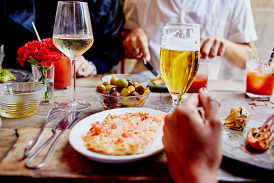 Midsection of man having food at table