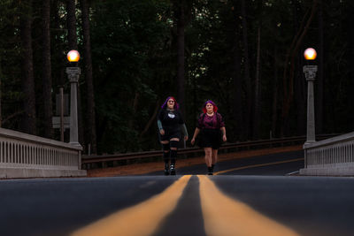 Women walking on paved road 