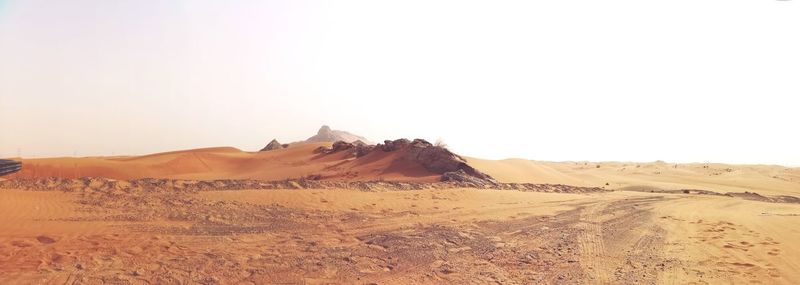 Scenic view of desert against clear sky