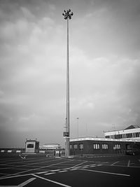 View of street light against cloudy sky