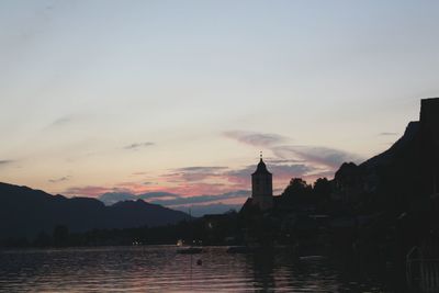 Calm sea with buildings in background