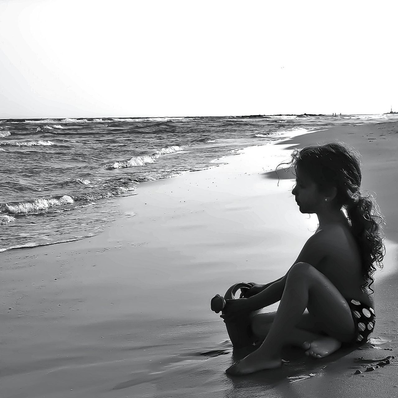 beach, sea, lifestyles, water, leisure activity, horizon over water, shore, sand, full length, young adult, person, young women, childhood, vacations, sitting, relaxation, clear sky