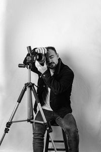 Portrait of young man photographing