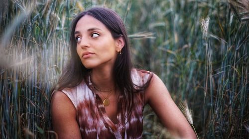 Portrait of a beautiful young woman looking away