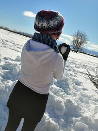 Man standing on snow covered land