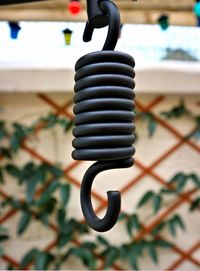 Close-up of spiral hanging on metal