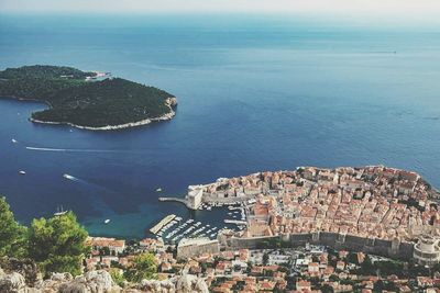 High angle view of town by sea