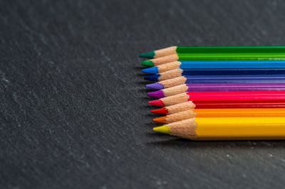 Close-up of colored pencils on table