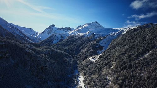 Scenic view of snowcapped mountains against sky