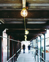Man hanging on ceiling