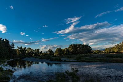 Scenic view of lake against blue sky