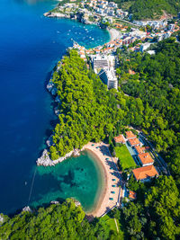 High angle view of townscape by sea