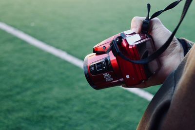 Close-up of hand holding camera