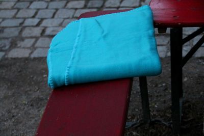 Close-up of empty chair against wall
