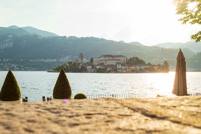 The island of san giulio in orta lake seen from the waterfront of the little town in northern italy