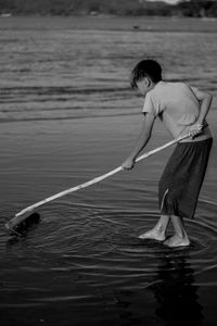 Woman standing in lake