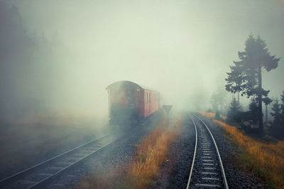 Train on railroad track against sky