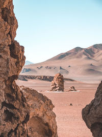 Rock formations in desert against sky