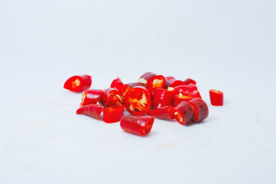 Close-up of red chili pepper over white background