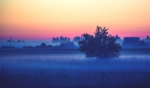 Scenic view of landscape at sunset