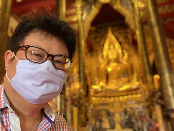 Portrait of mid adult man at temple