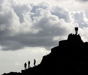 Low angle view of castle against cloudy sky