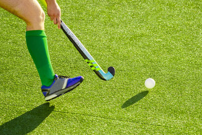 Low section of sportsperson playing hockey