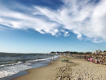 View of beach against cloudy sky