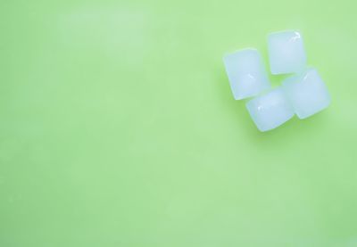 Close-up of dentures over yellow background