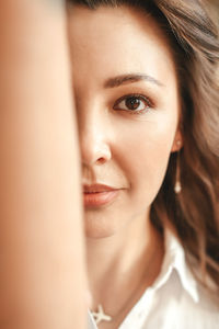 Close-up portrait of beautiful woman with her hair down