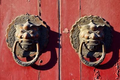 Close-up of sculpture on door