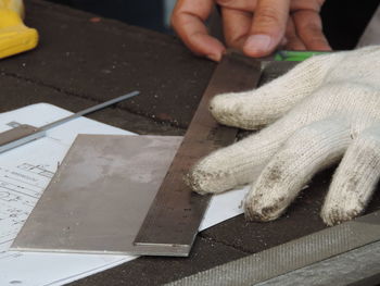 High angle view of person working on table