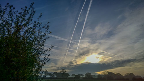 Low angle view of vapor trails in sky