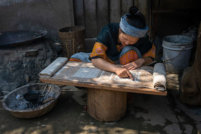 Midsection of woman working in basket